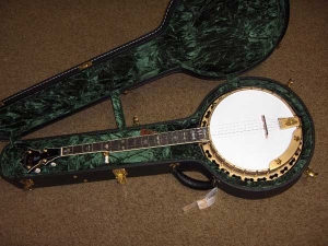 The Red Fox Deluxe banjo has gold finished hardware, with tailpiece engraved with a Fox head-13
